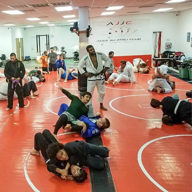 Advanced students sparring in a Black Belt Leadership Training class at Aces Jiu Jitsu Club